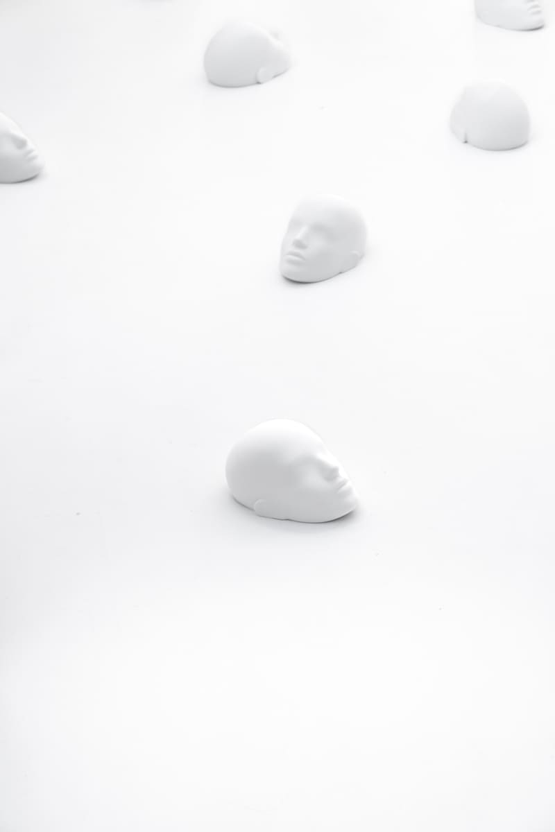 View on multiple sculptures spread around the room laying on the floor from the project "Femicide" of the Visual Artist Irena Pejčić.