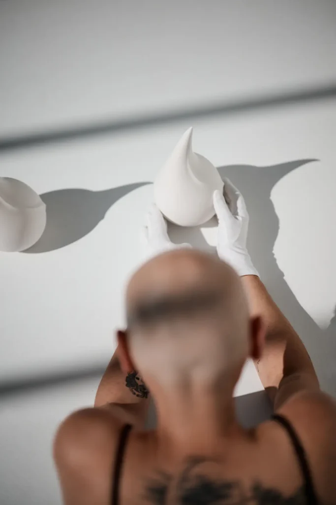 White sculptures shaped like a drop or flame