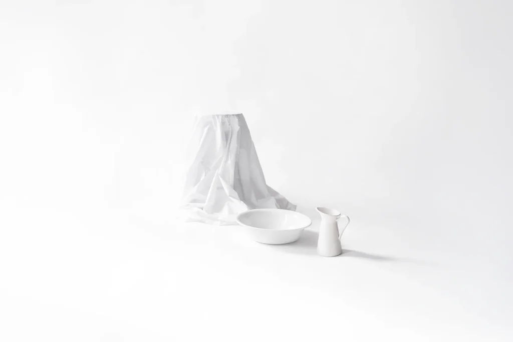 White chair, white carraffe and white tub