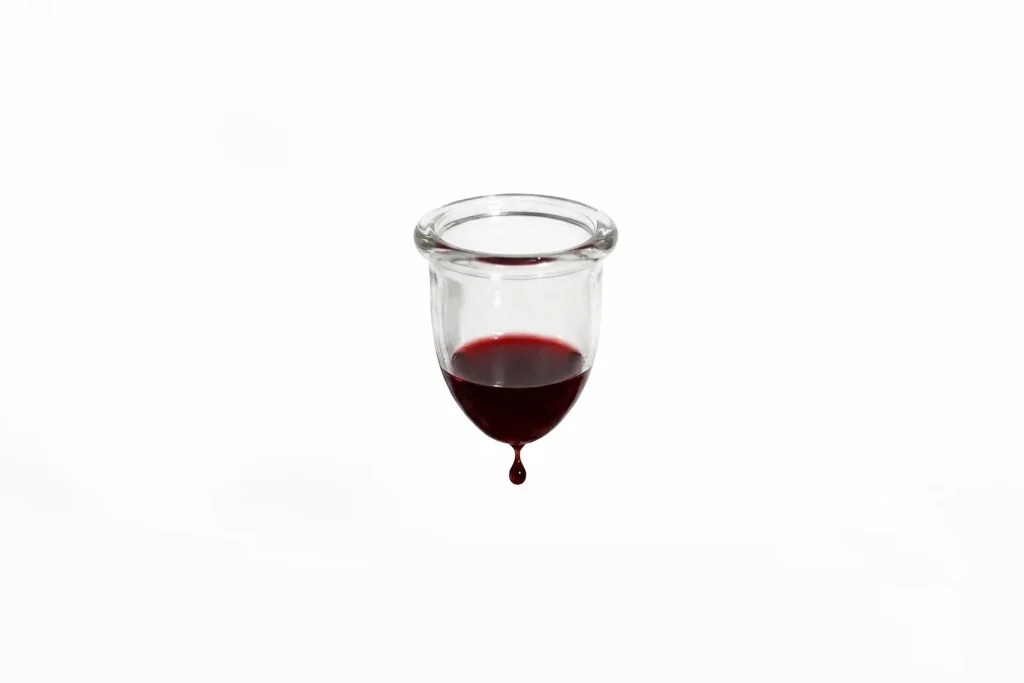 Hanging menstrual cup filled with blood