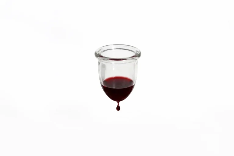 Hanging menstrual cup filled with blood
